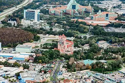 Helicopter aerial view of Walt Disney World theme parks including Epcot, Hollywood Studios, and Animal Kingdom in Orlando